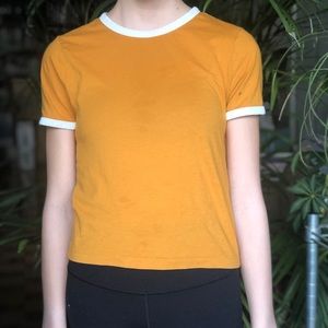 Women’s yellow shirt.